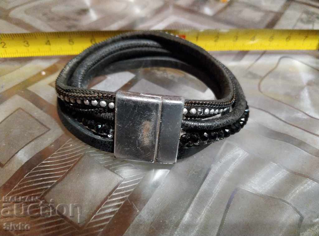 Metal and leather hryvnia