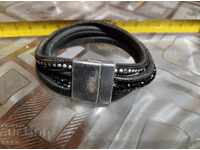 Metal and leather hryvnia