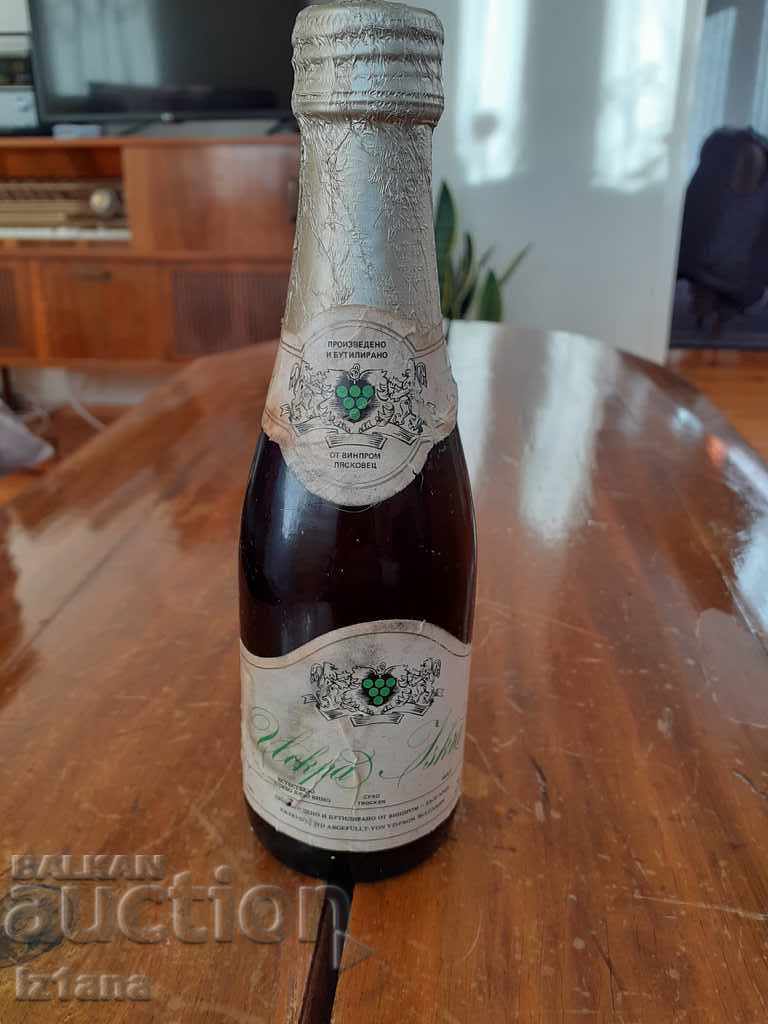 Old bottle of sparkling champagne