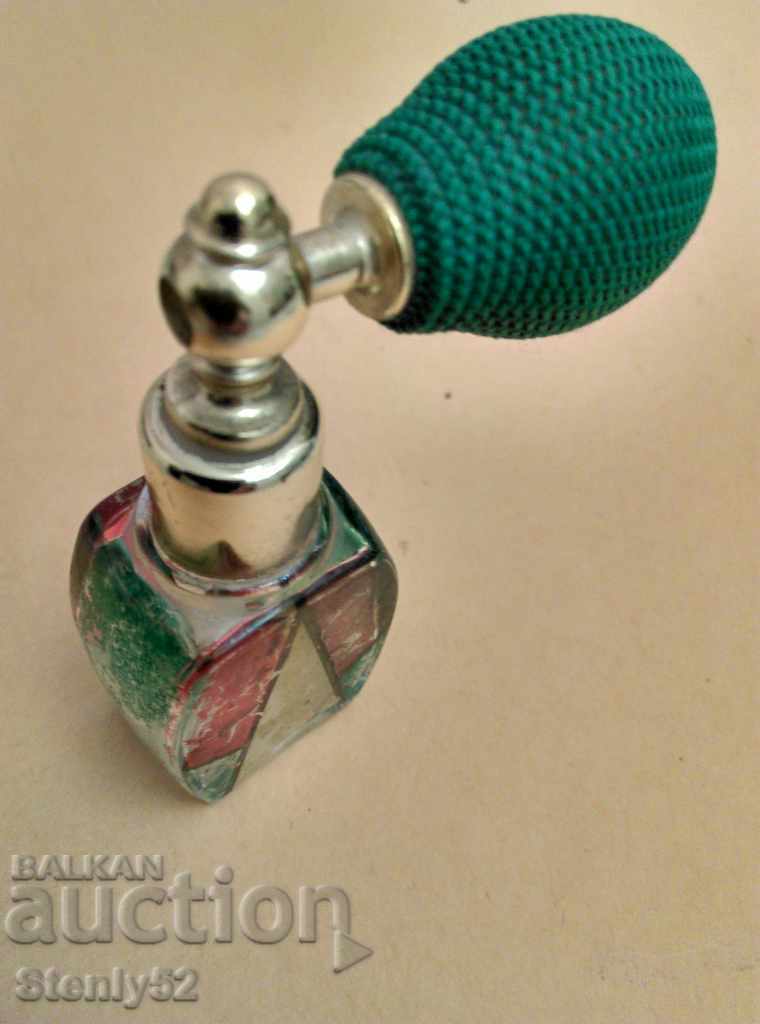 Old vintage perfume bottle with rubber pump.