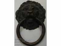 Old massive bronze door knocker "LION'S HEAD".