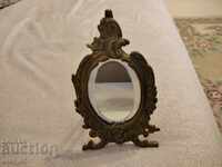 Old table, baroque mirror frame
