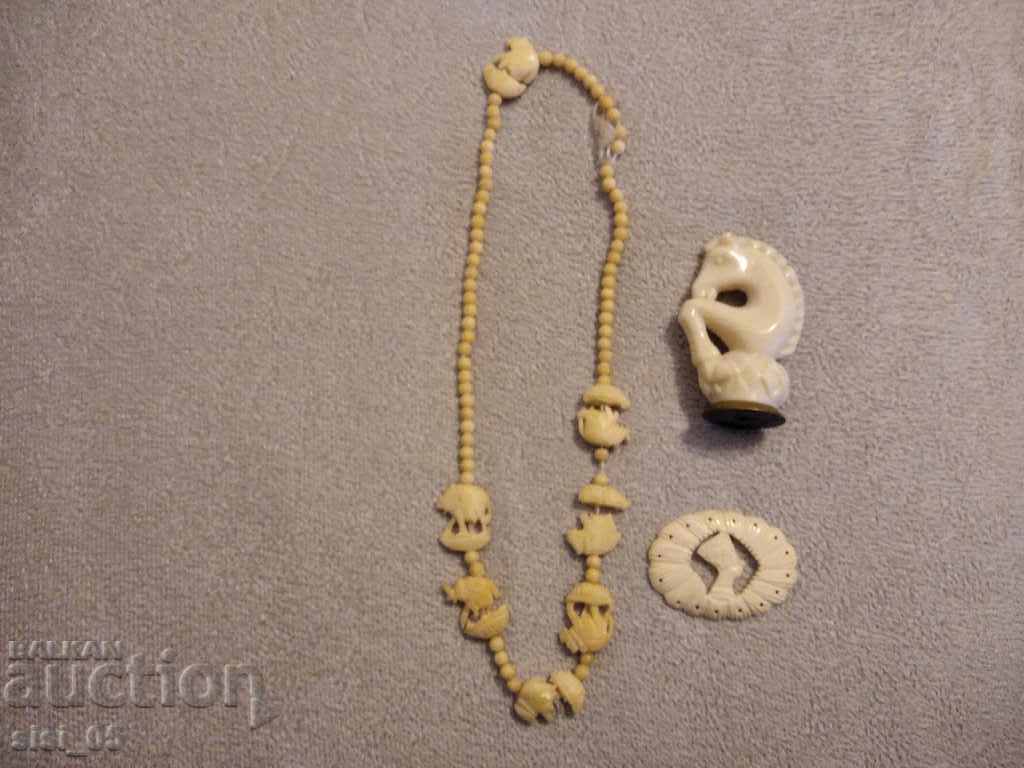 Necklace, ivory figures, bone