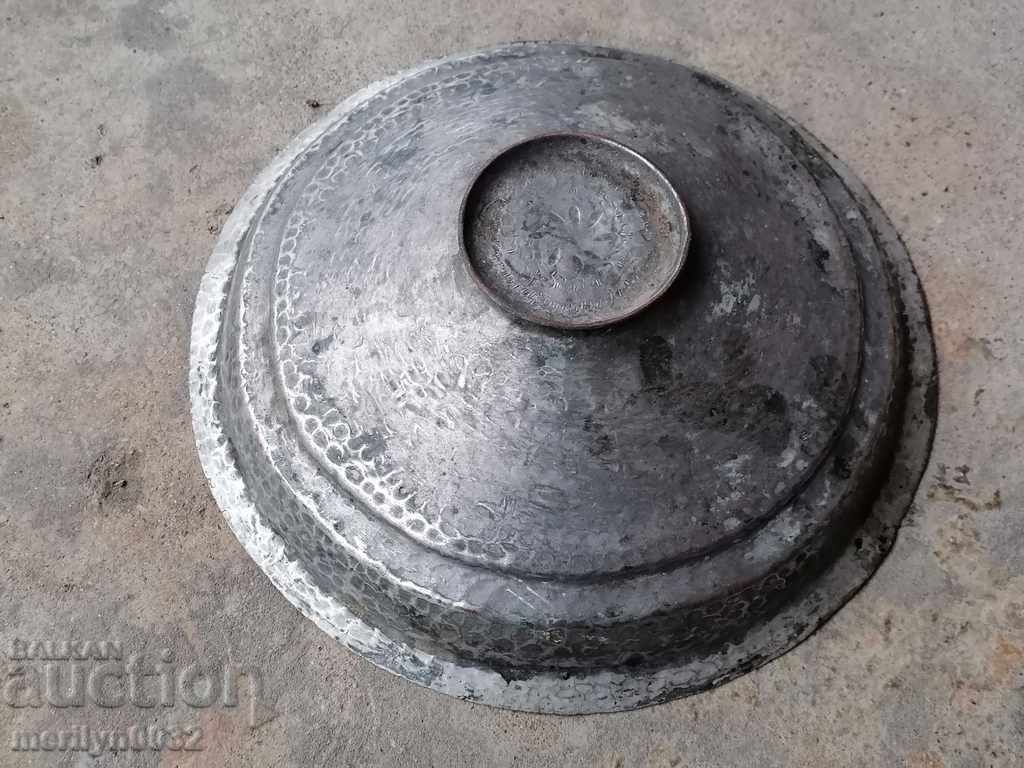 Delivery of Hand-hammered copper lid from a copper copper pot Delivery of Hand-hammered copper lid from a copper copper pot