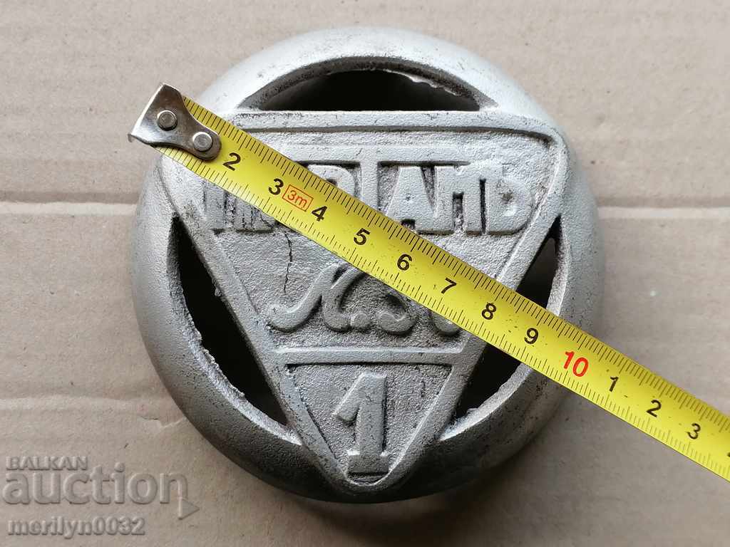 Auction Cast iron emblem of an old stove Auction Cast iron emblem of an old stove