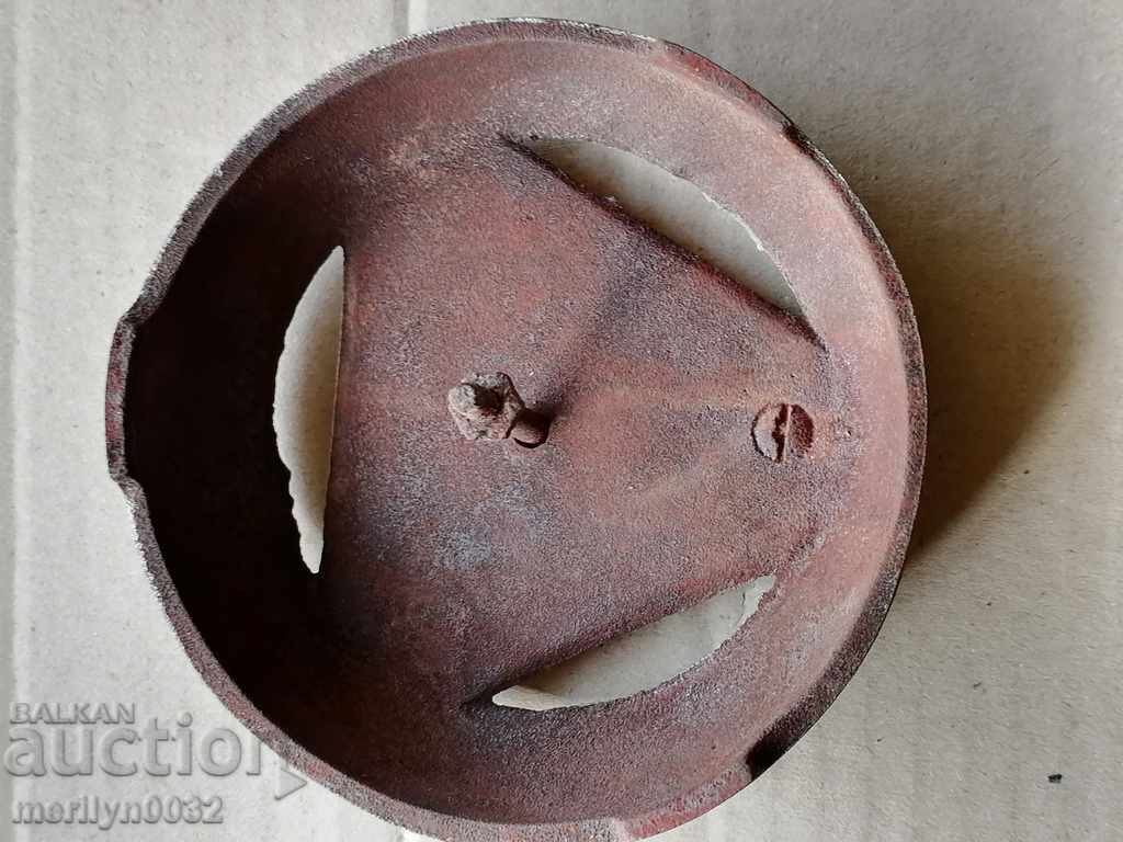 Delivery of Cast iron emblem of an old stove Delivery of Cast iron emblem of an old stove