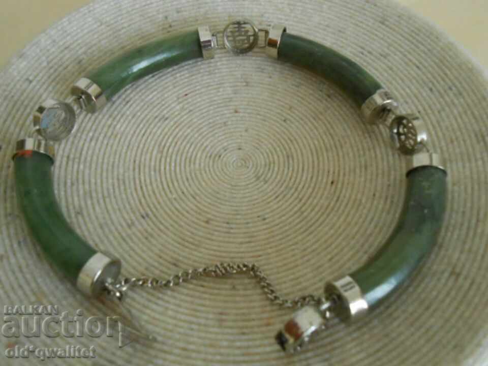 Auction Hryvnia with natural Jade, elements with blessing Auction Hryvnia with natural Jade, elements with blessing