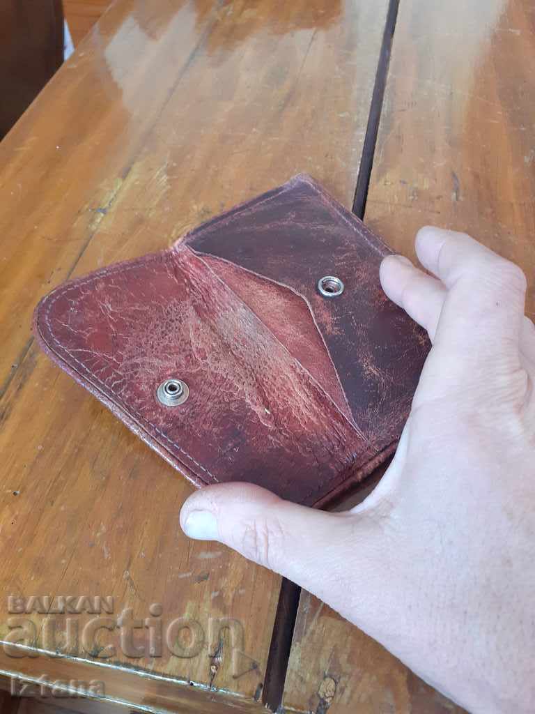 Delivery of An old leather purse Delivery of An old leather purse