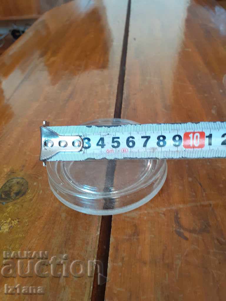 Delivery of Old glass jar lid