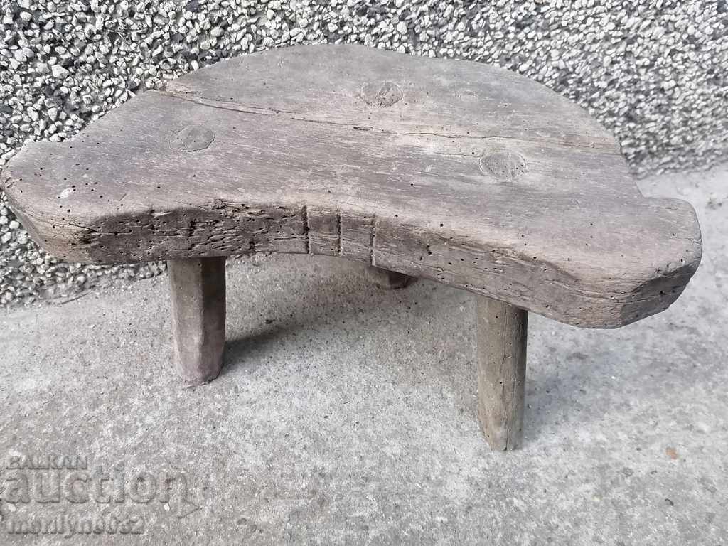 Old three-legged stool, chair, wooden, primitive