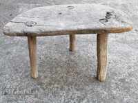 Old three-legged stool, chair, wooden, primitive