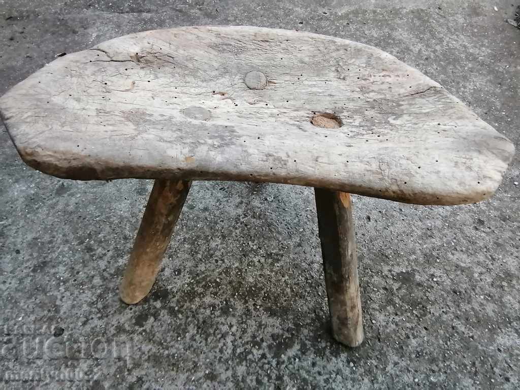 Old three-legged stool, chair, wooden, primitive