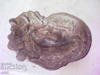 Old bronze ashtray with a woman