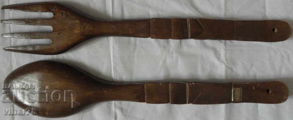 Delivery of an old wooden fork and a wall spoon Delivery of an old wooden fork and a wall spoon