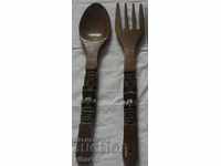 an old wooden fork and a wall spoon