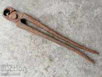 Old blacksmith's tongs, shingles, wrought iron