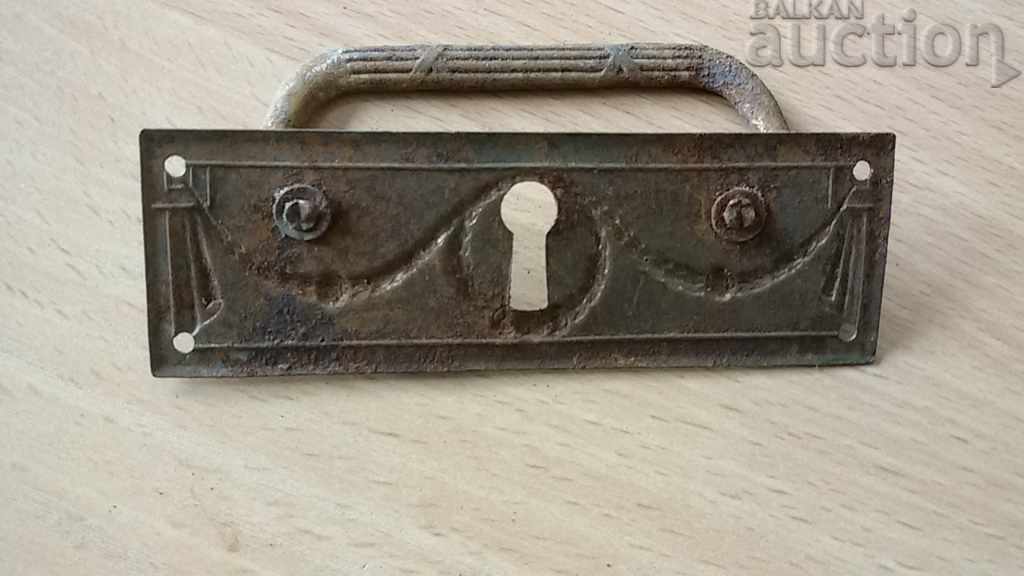 Delivery of hardware handle from antique chest of drawers