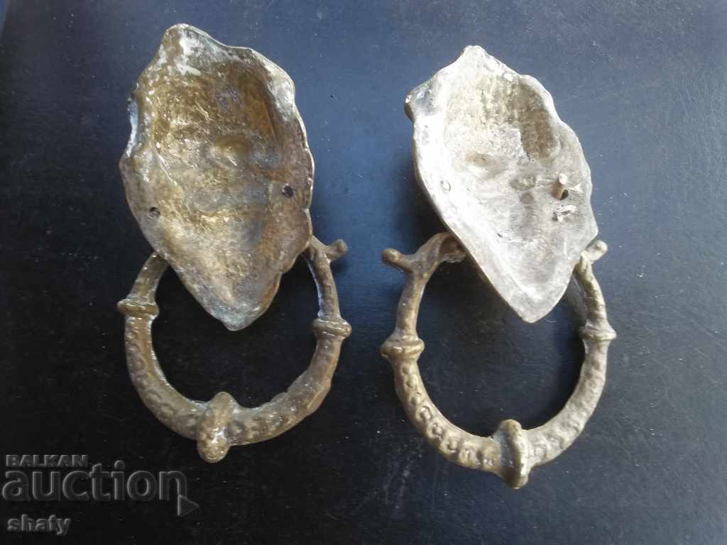 Delivery of Old knock on the door. Bronze door rings Delivery of Old knock on the door. Bronze door rings