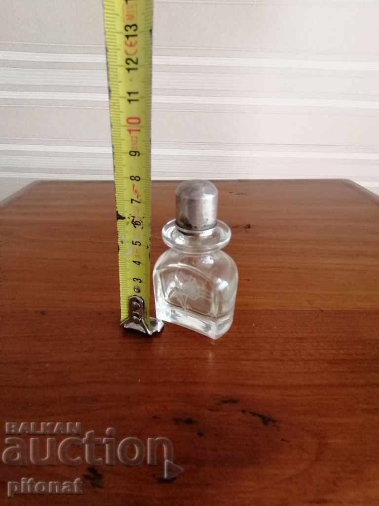 Delivery of Vintage perfume bottle with silver cap