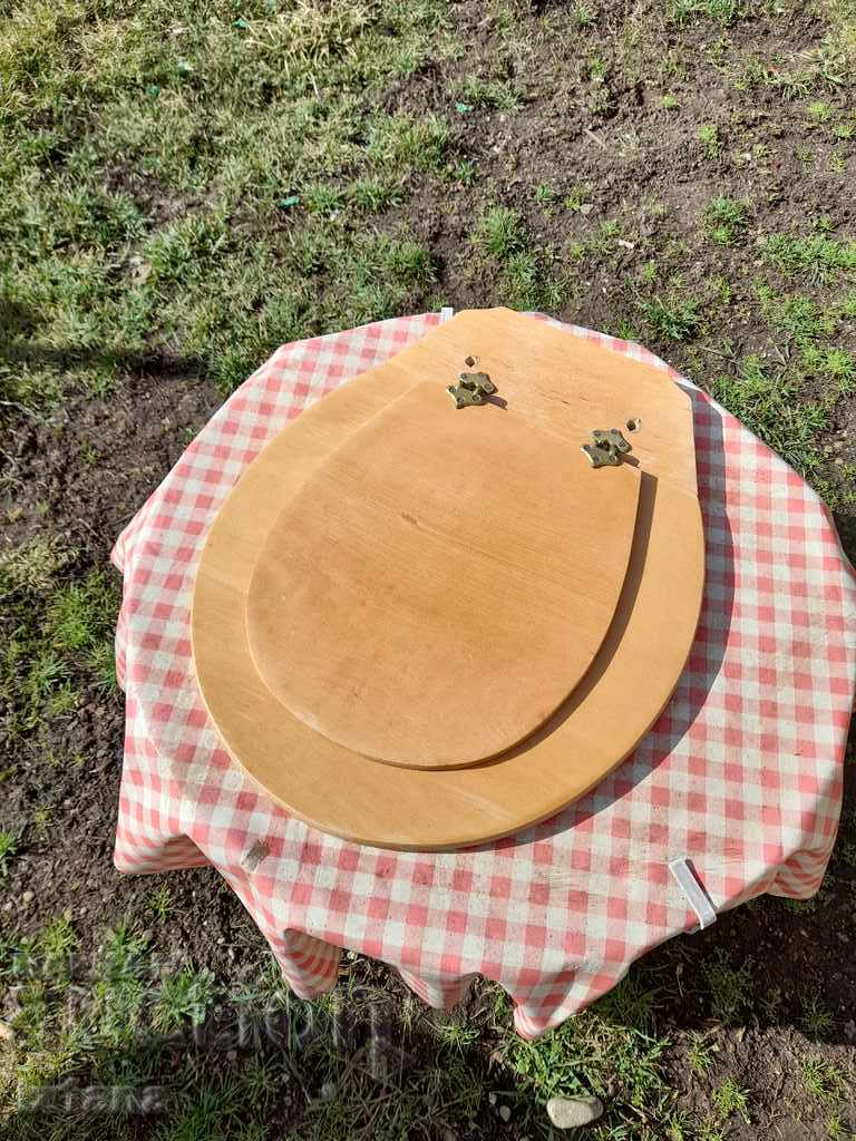 Old wooden lid for toilet bowl