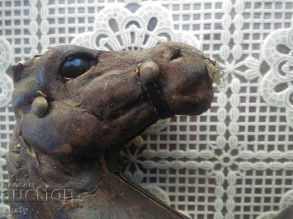 Auction  Old leather horses.