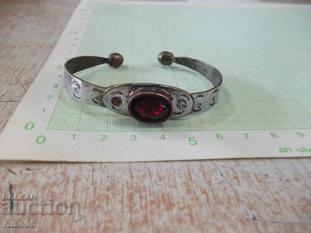 Old bracelet with red stone
