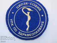Patch emblem from the time of the Socialist-Criminal Procedure Code in healthcare