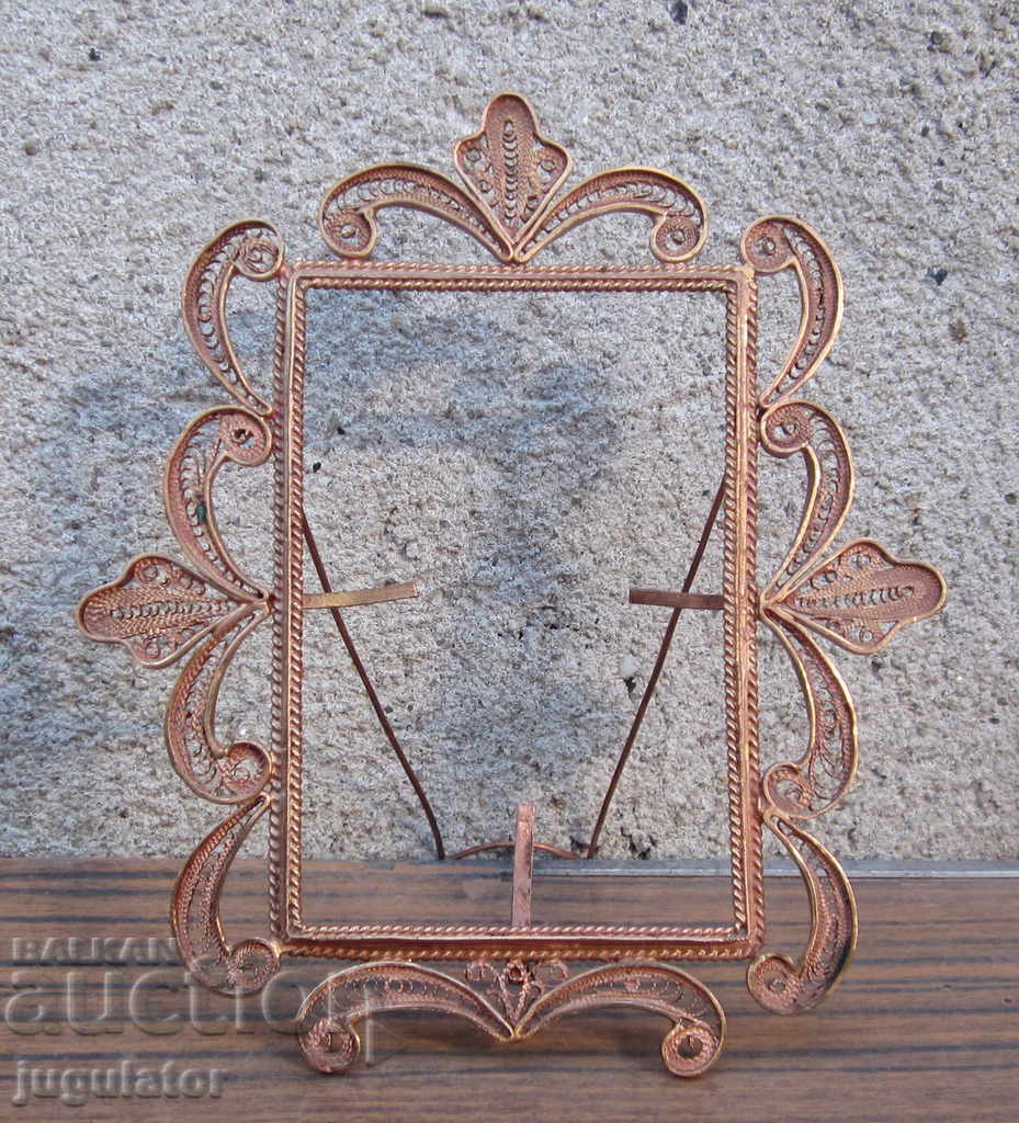 old table photo frame made of openwork copper filigree
