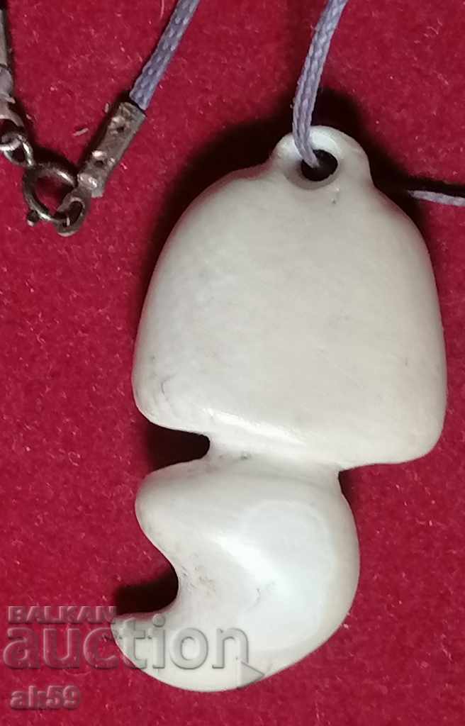 Old necklace, ivory amulet.