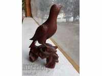 Old beautiful wooden statuette - chick - wood carving