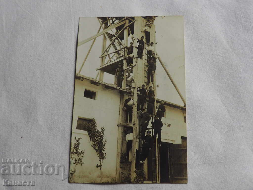 Old photo students on a wooden tower