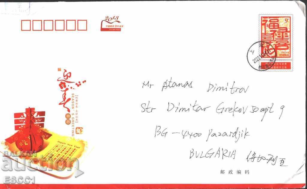 Traveled envelope with printed stamp New Year 2013 from China