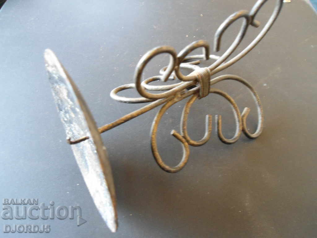 An old metal candleholder with price 3.00 BGN | € 1.53 An old metal candleholder with price 3.00 BGN | € 1.53