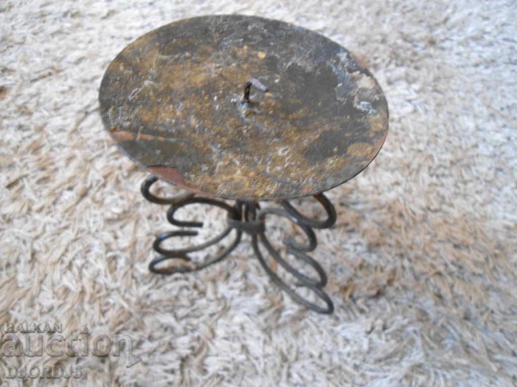 Auction An old metal candleholder Auction An old metal candleholder
