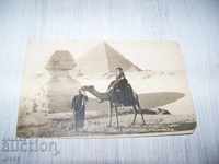 Old postcard of a Bulgarian woman in front of the Sphinx and the pyramids 1922