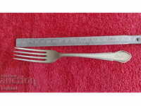Old silver-plated fork kitchen utensils