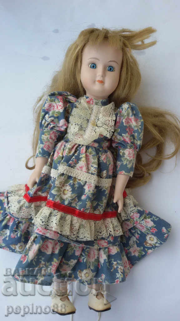 Porcelain doll with glass blue eyes / 40 cm