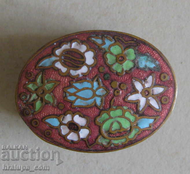 Old brass box with enamel decoration