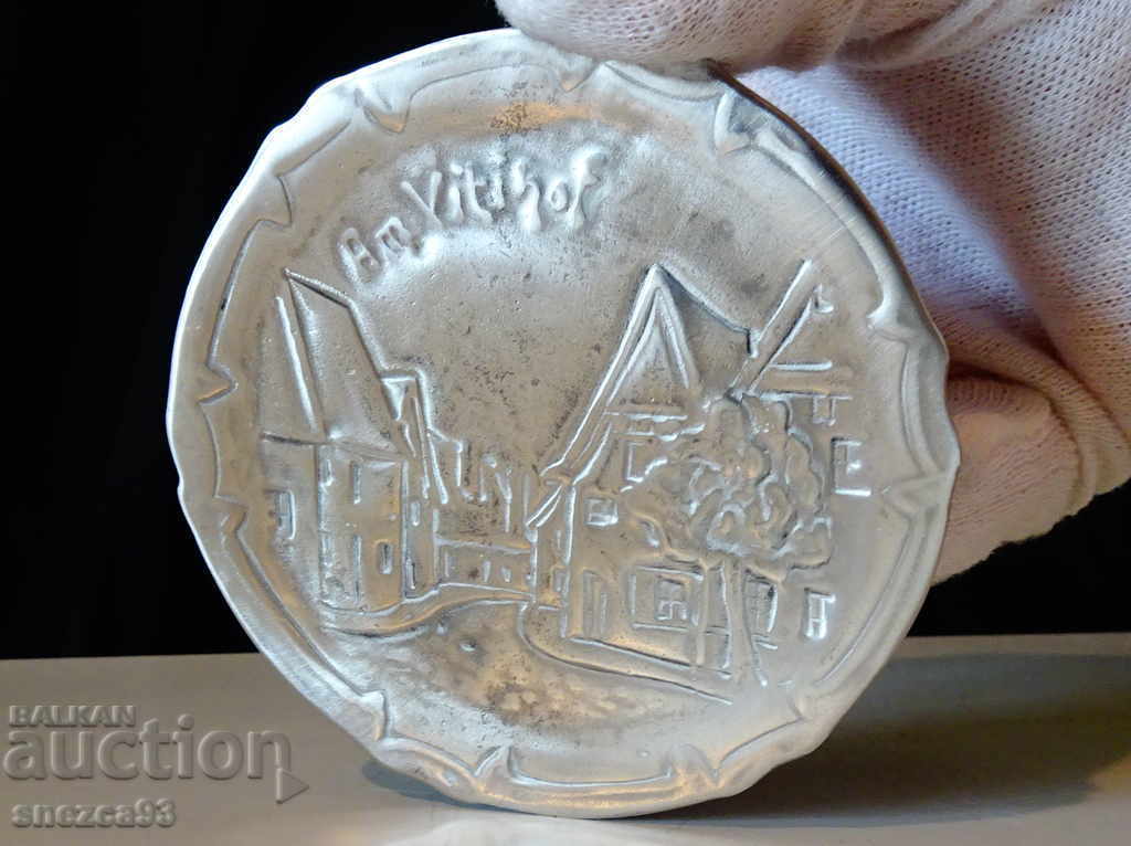 Delivery of Pewter plate, embossed image of old buildings