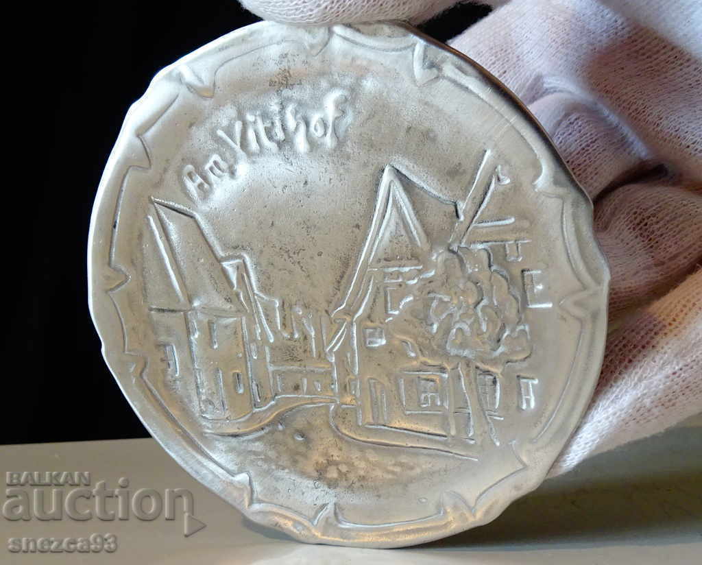 Pewter plate, embossed image of old buildings