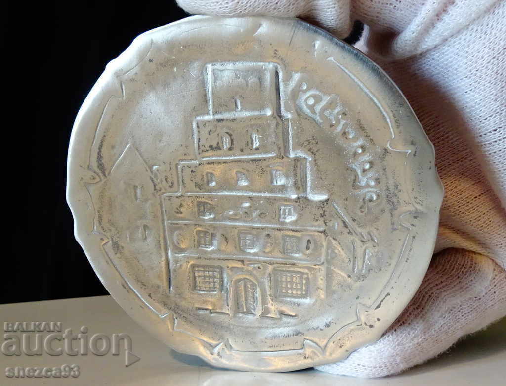 Pewter plate, embossed image of a Gothic church