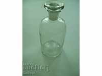 Old pharmacy bottle with polished stopper