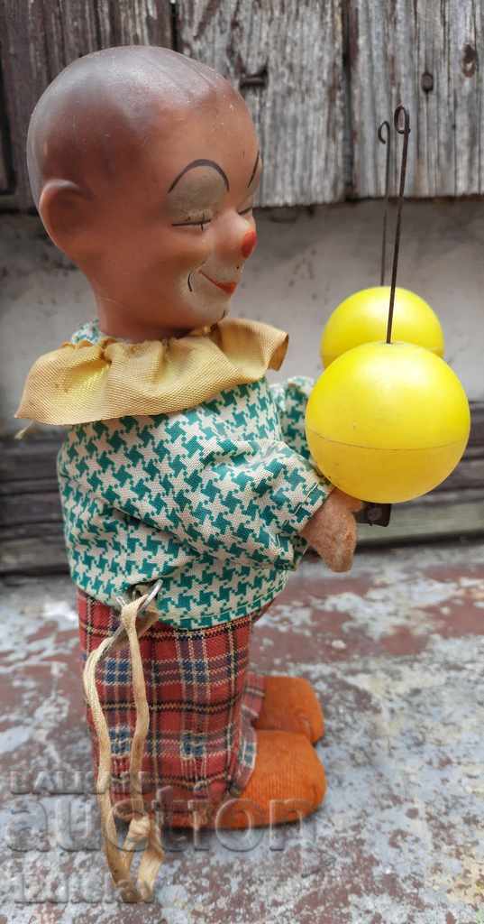 Auction Old mechanical clown toy Auction Old mechanical clown toy