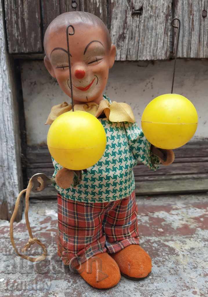 Delivery of Old mechanical clown toy Delivery of Old mechanical clown toy