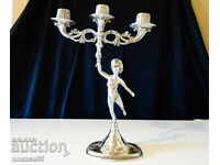 English triple pewter candle holder with figure.