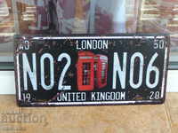 Metal plate number UK London telephone booth