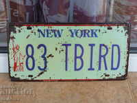 Metal number plate car American New York State statue