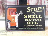 Metal license plate stop and pour Shell Shell motor oil
