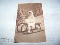 Child with sleigh, old postcard - photo, Romania