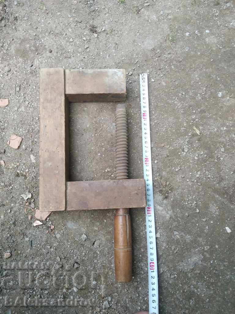 Old wooden carpenter's clamp